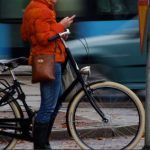 cell phone user and bike