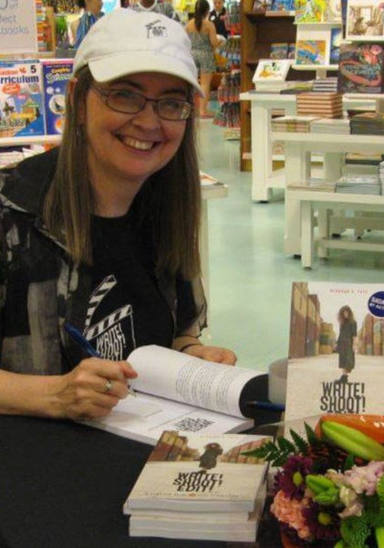 Deb signs books