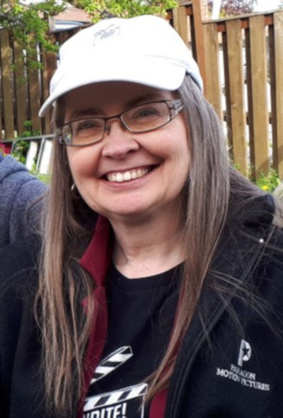 Deb Patz in white baseball hat