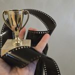 Hand holding an award